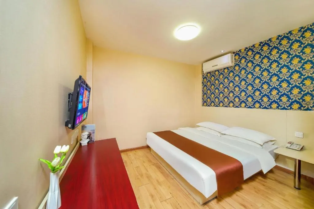 Bed in Kunlun Leju Business Hotel Kaifeng Gulou