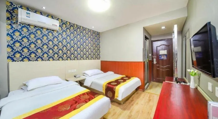 Bed in Kunlun Leju Business Hotel Kaifeng Gulou