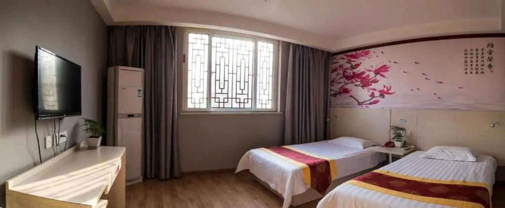 Bed in Kunlun Leju Business Hotel Kaifeng Gulou