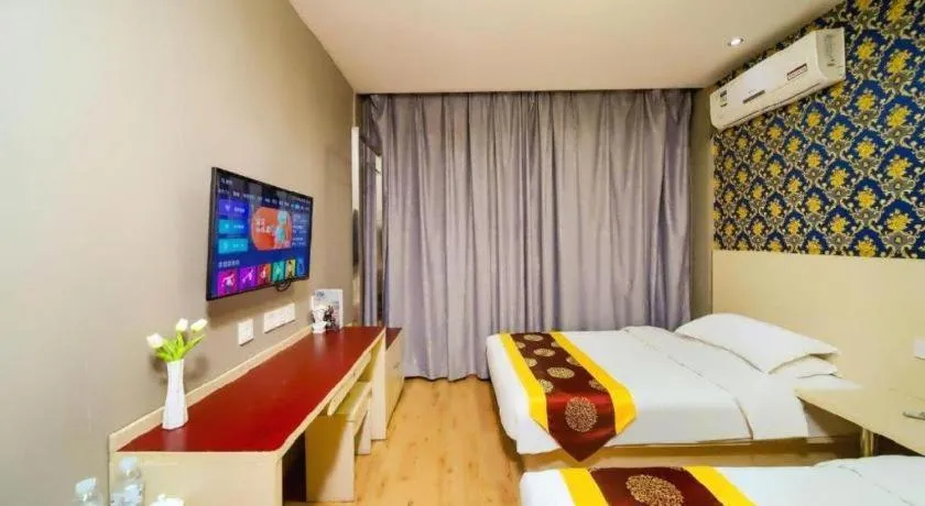 Bed in Kunlun Leju Business Hotel Kaifeng Gulou