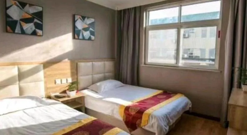 Bed in Kunlun Leju Business Hotel Kaifeng Gulou