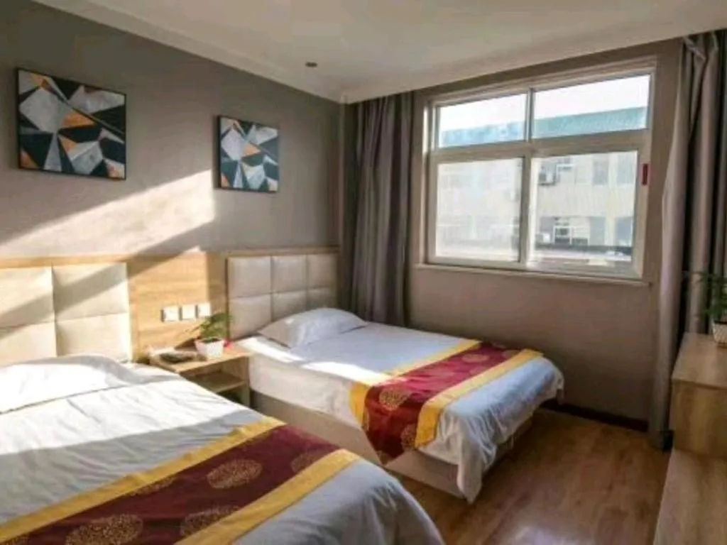 Bed in Kunlun Leju Business Hotel Kaifeng Gulou