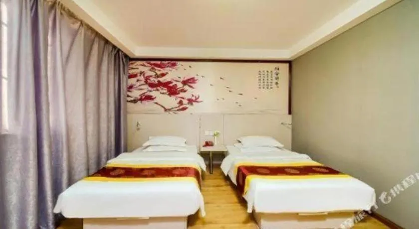 Bed in Kunlun Leju Business Hotel Kaifeng Gulou