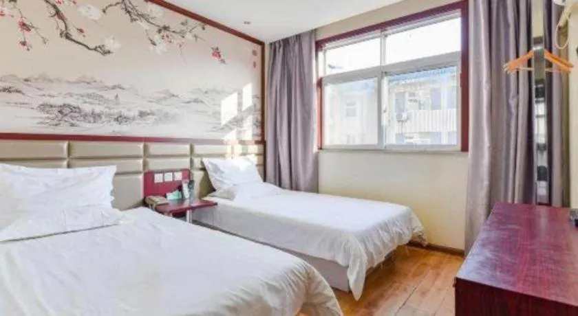 Bed in Kunlun Leju Business Hotel Kaifeng Gulou