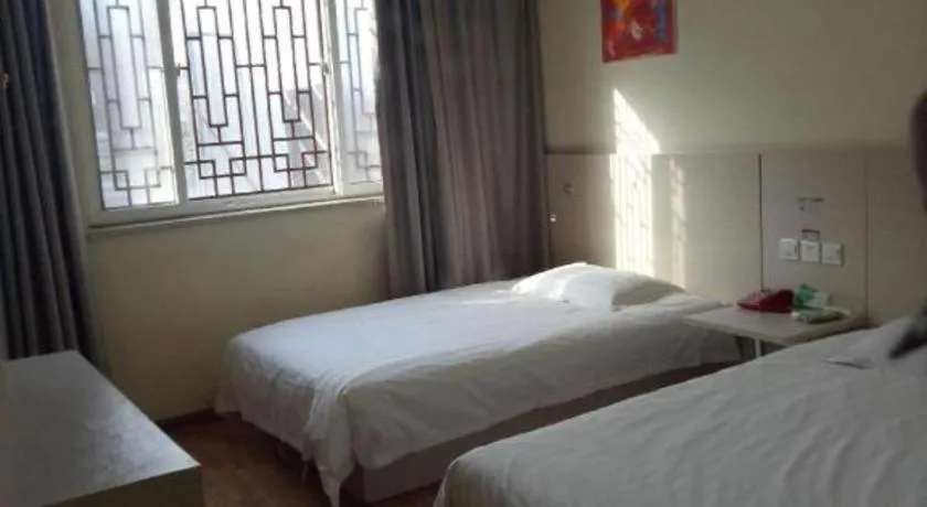 Bed in Kunlun Leju Business Hotel Kaifeng Gulou