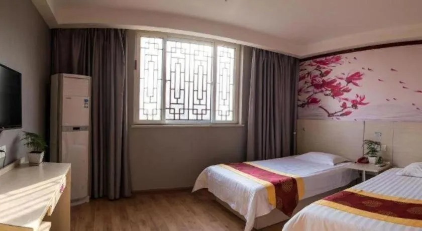 Bed in Kunlun Leju Business Hotel Kaifeng Gulou