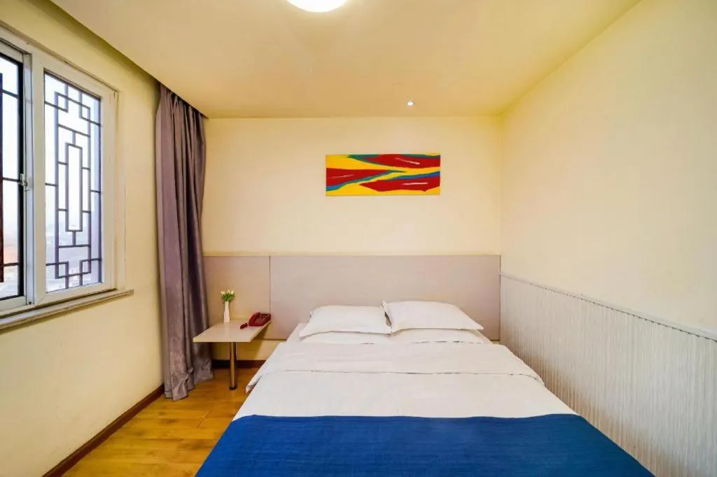 Bed in Kunlun Leju Business Hotel Kaifeng Gulou