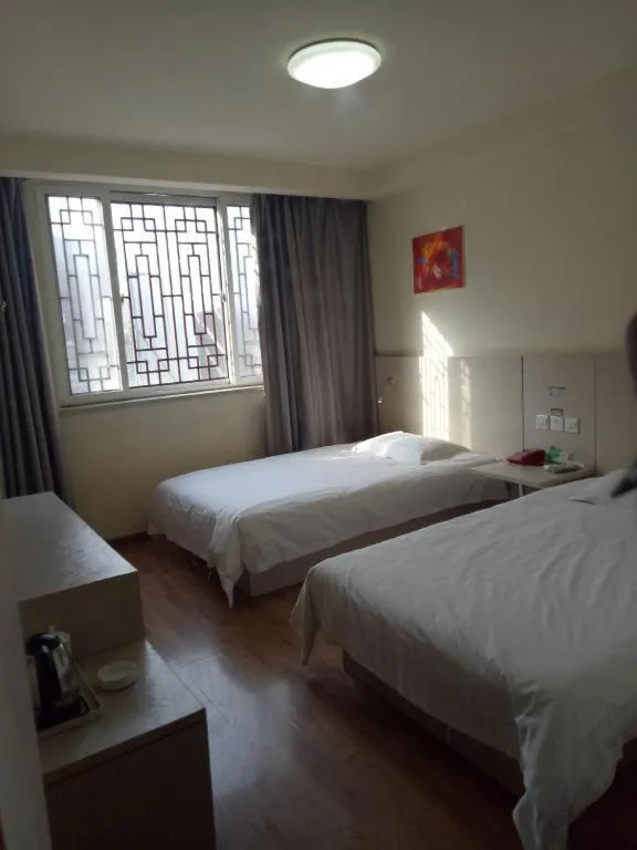 Bed in Kunlun Leju Business Hotel Kaifeng Gulou