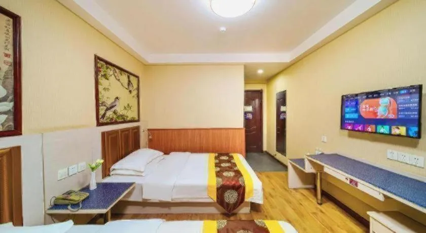 Bed in Kunlun Leju Business Hotel Kaifeng Gulou