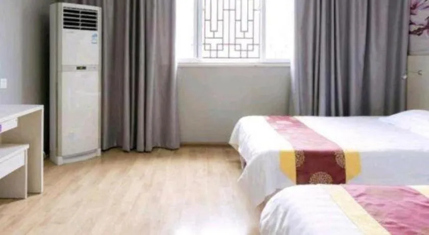Bed in Kunlun Leju Business Hotel Kaifeng Gulou