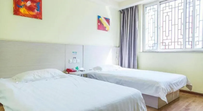 Bed in Kunlun Leju Business Hotel Kaifeng Gulou