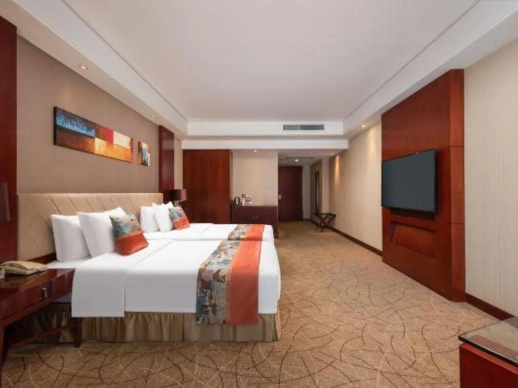 Bed in Wuhan Soluxe Hotel