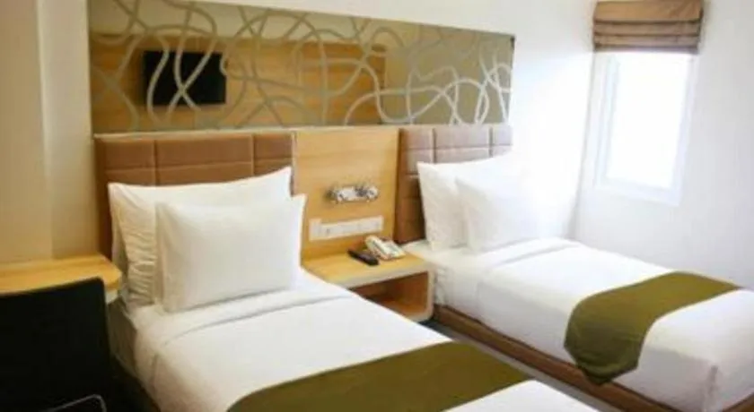 Bed in Sub City Hotel