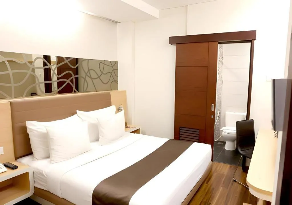 Bed in Sub City Hotel