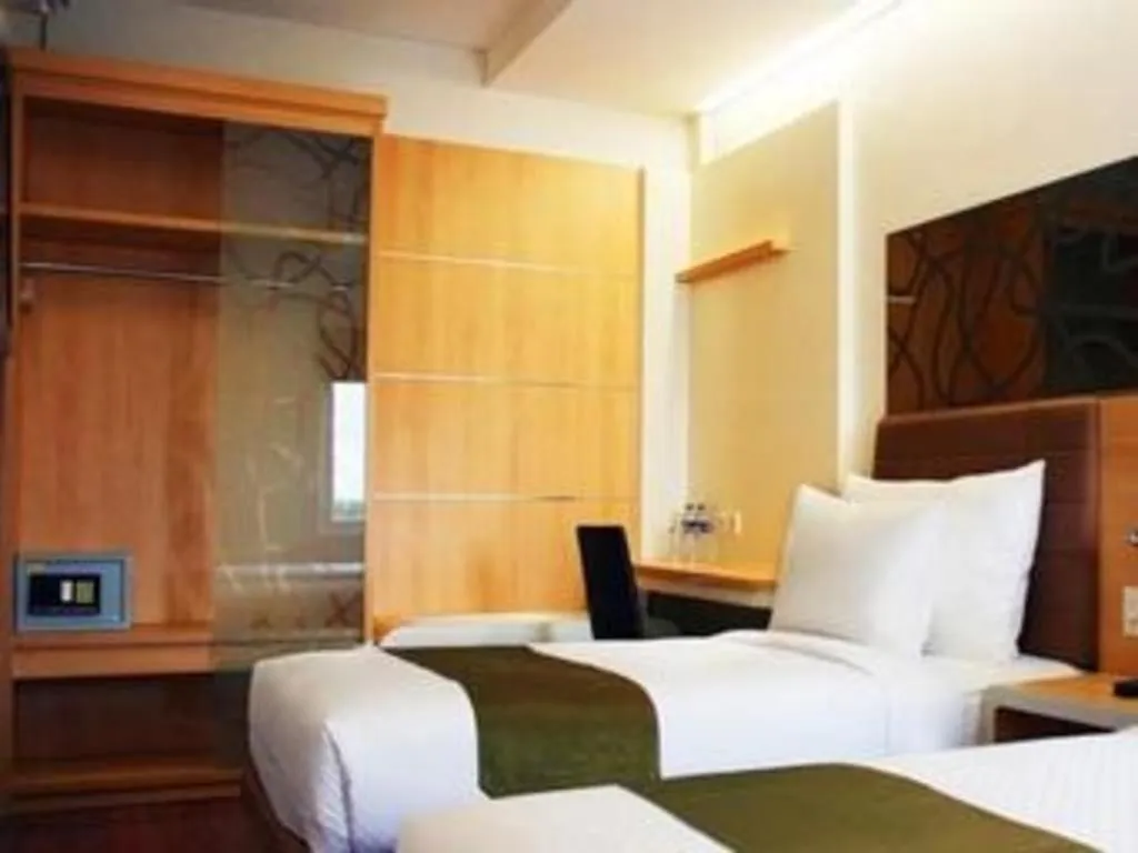 Bed in Sub City Hotel