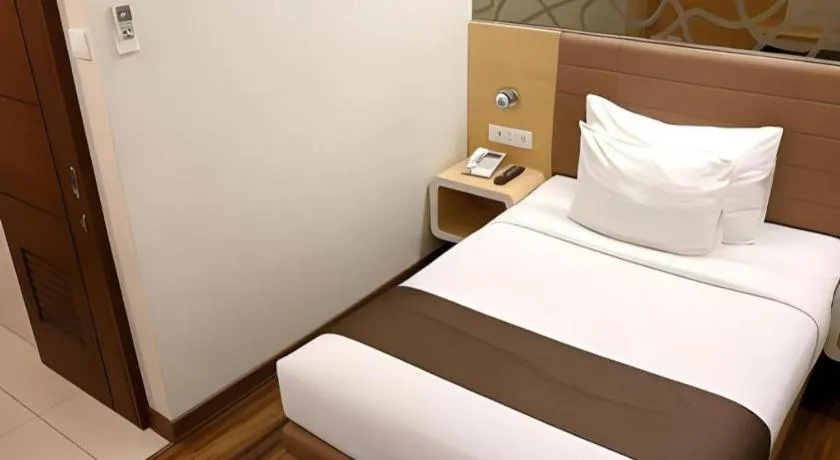 Bed in Sub City Hotel