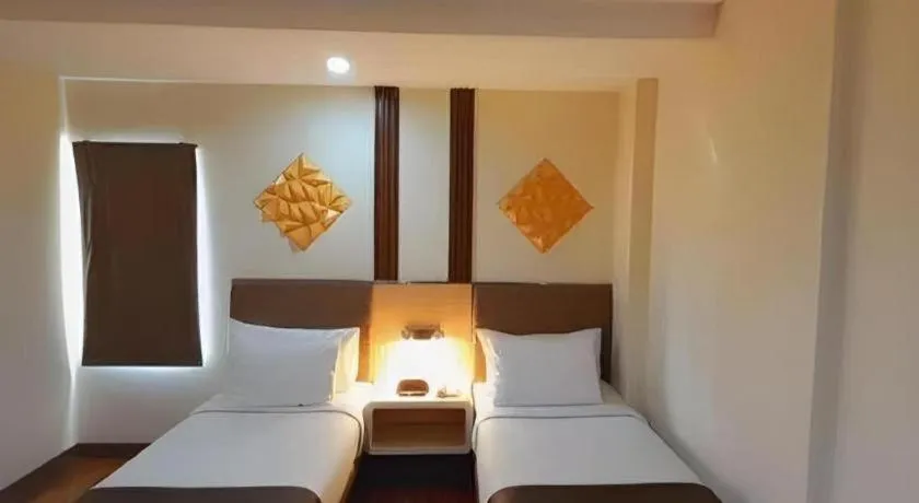 Bed in Sub City Hotel