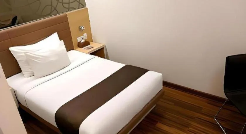 Bed in Sub City Hotel