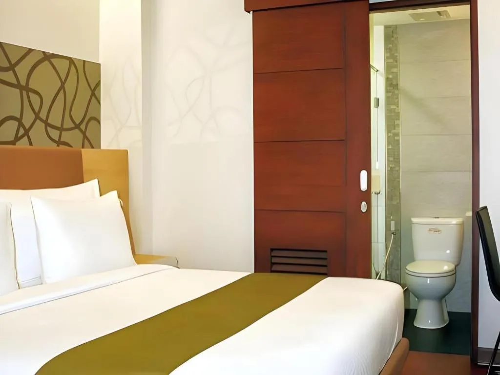 Bed in Sub City Hotel