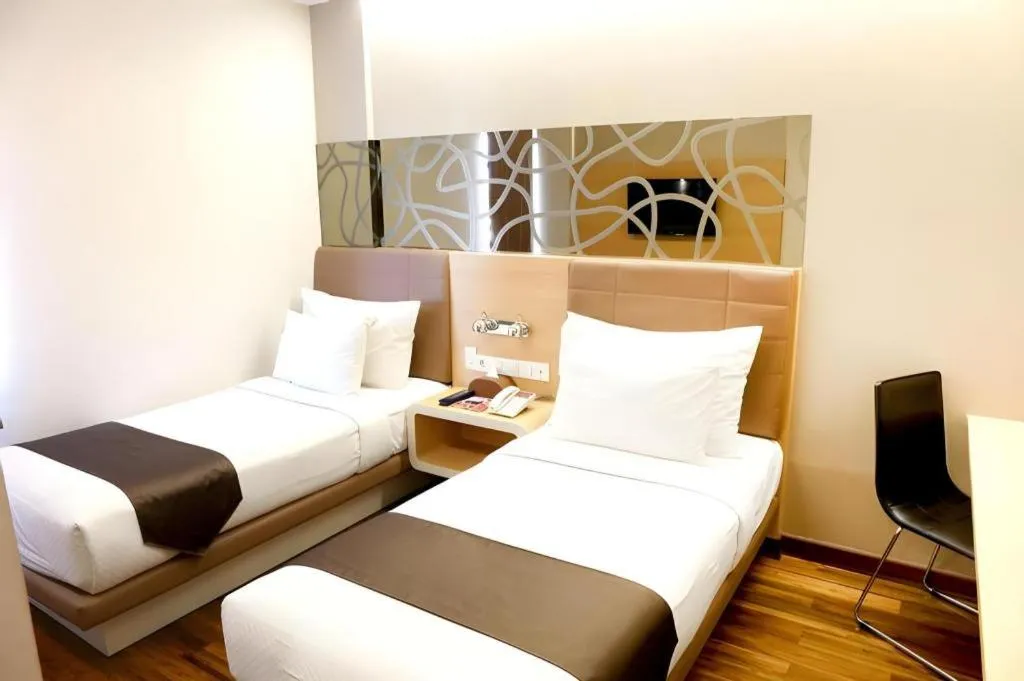 Bed in Sub City Hotel