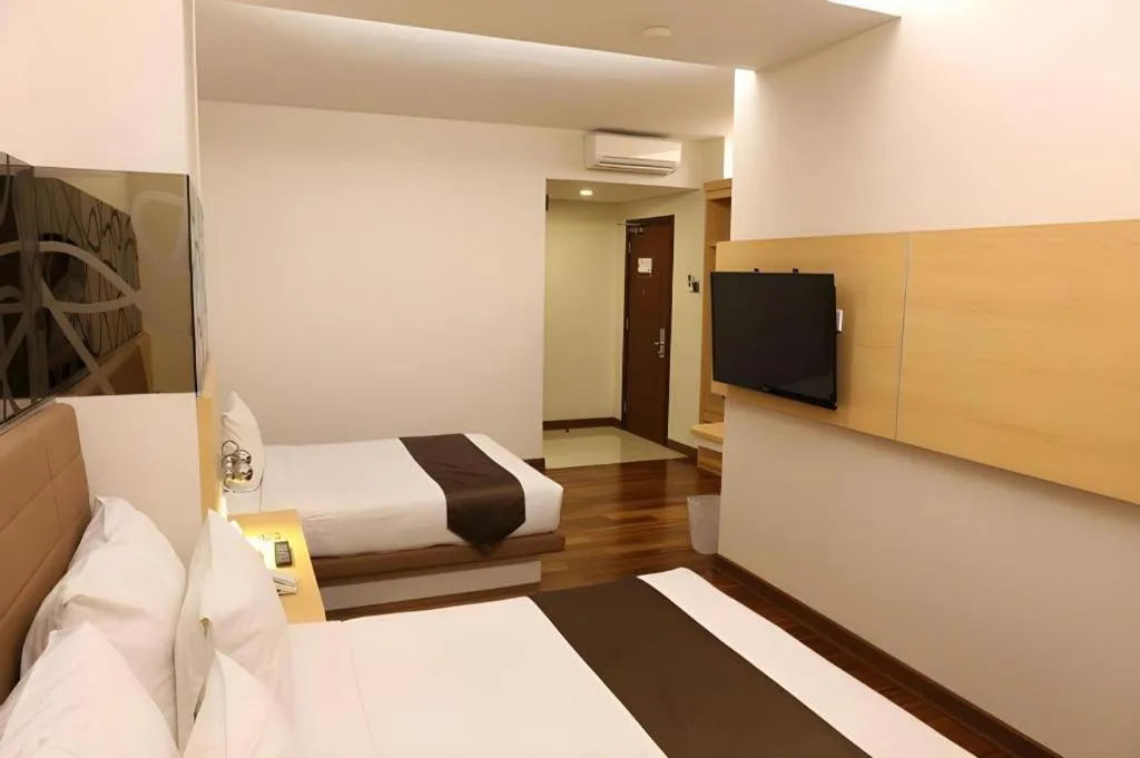 Bed in Sub City Hotel