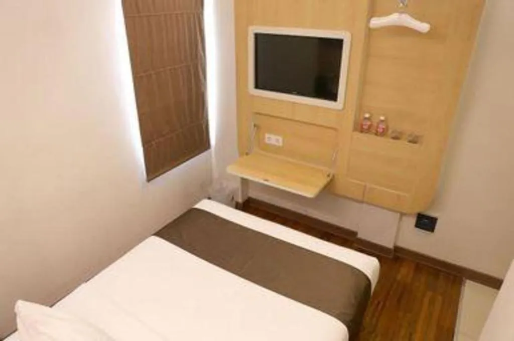 Bed in Sub City Hotel