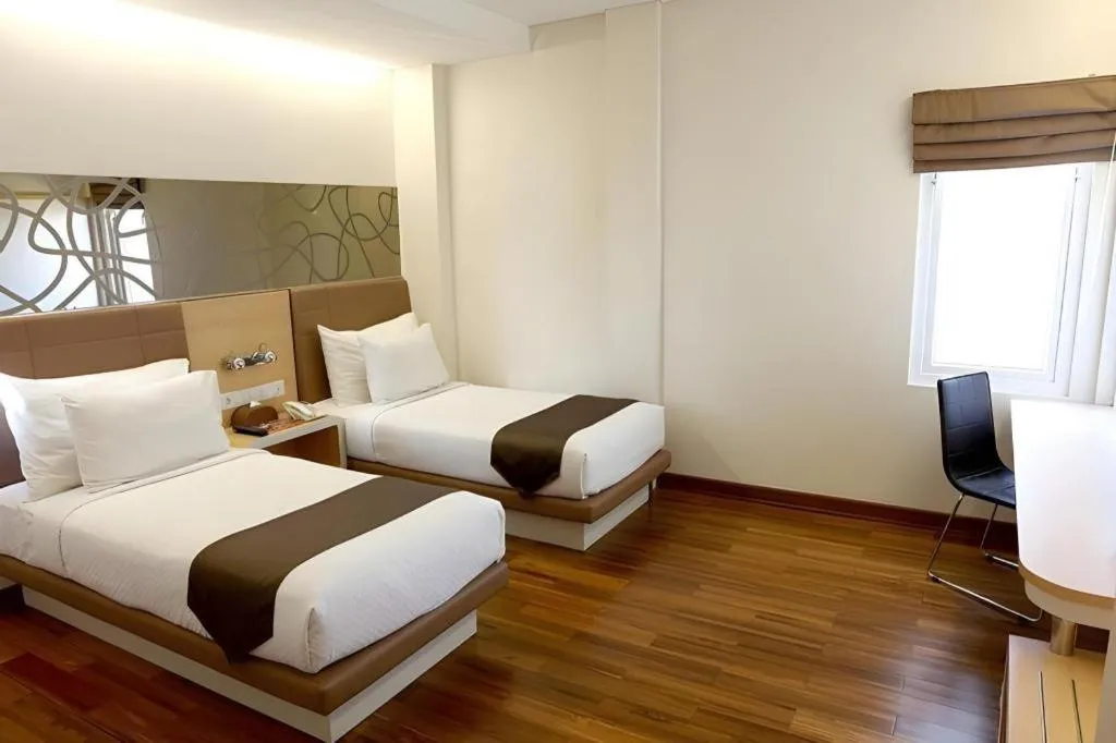 Bed in Sub City Hotel