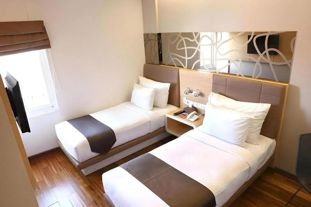 Bed in Sub City Hotel