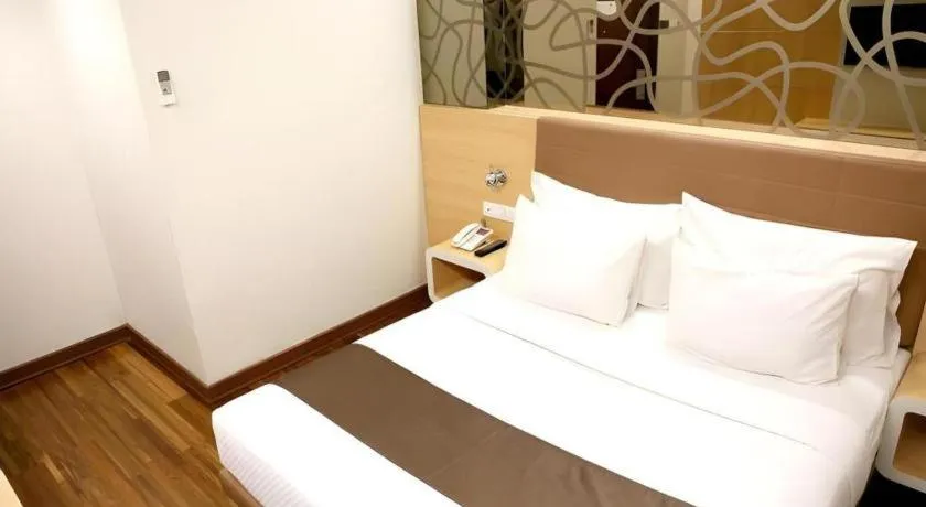 Bed in Sub City Hotel