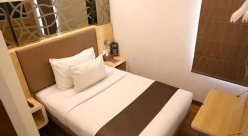 Bed in Sub City Hotel