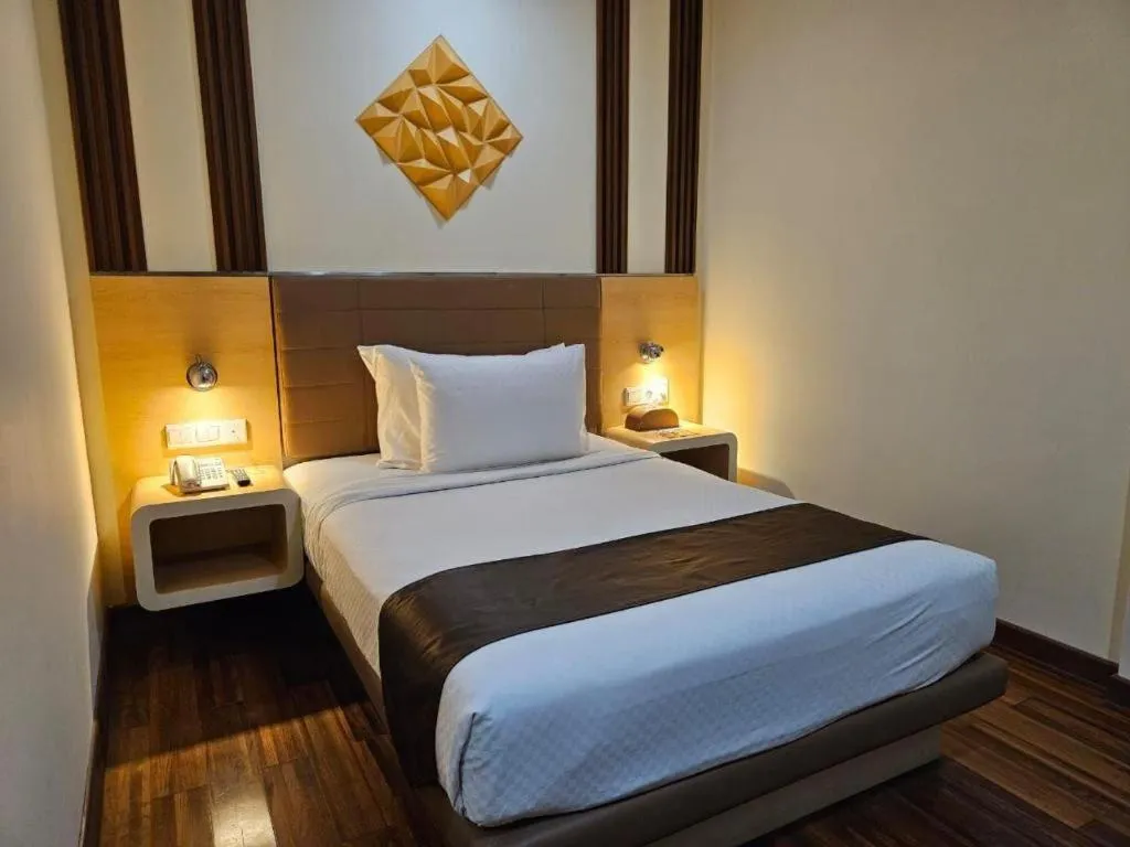 Bed in Sub City Hotel