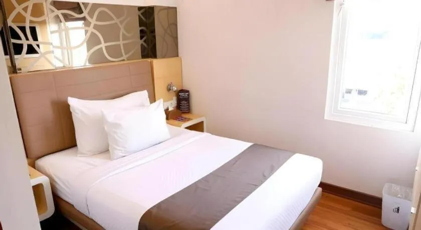 Bed in Sub City Hotel