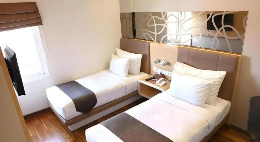 Bed in Sub City Hotel