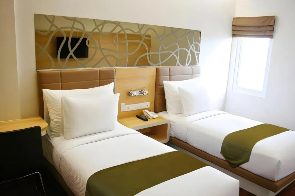 Bed in Sub City Hotel