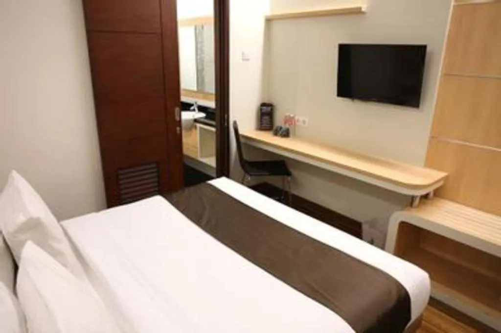 Bed in Sub City Hotel