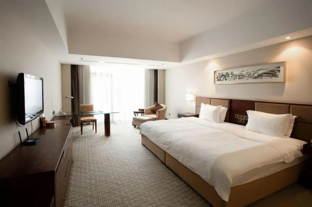 Bed in Blue Horizon International Hotel Gaomi