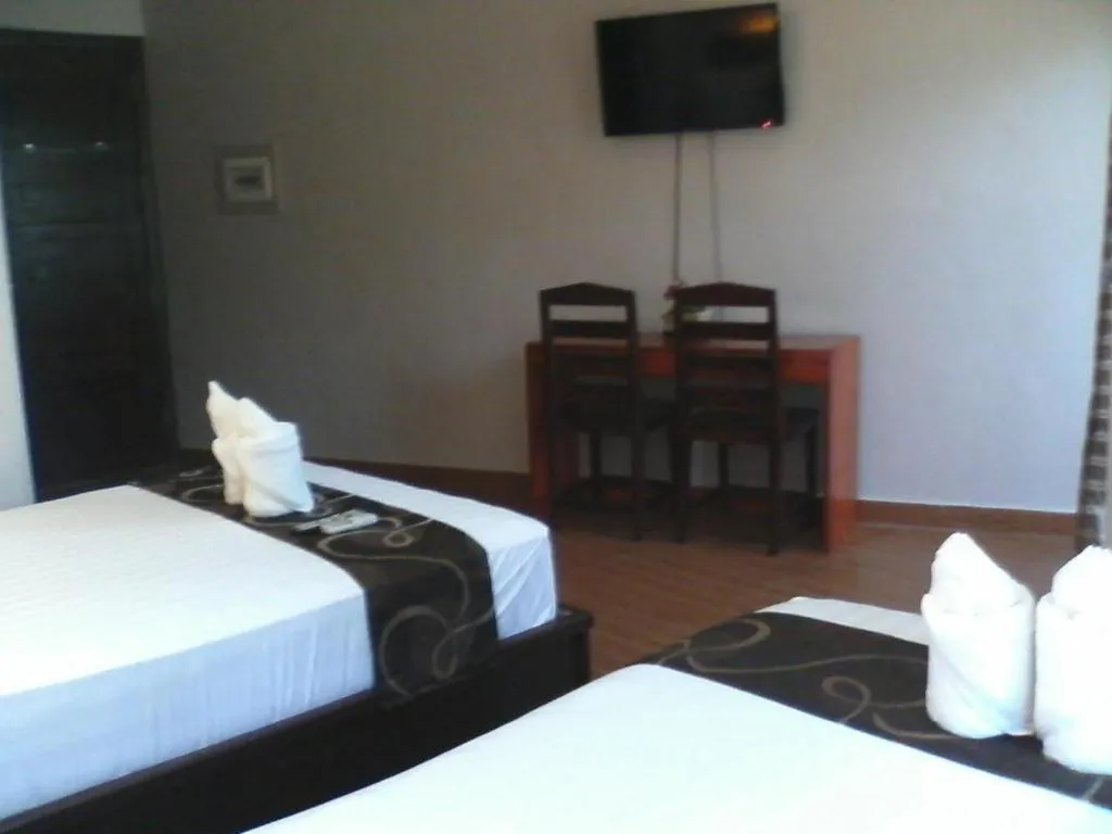 Bed in Rovic's Tourist Hotel