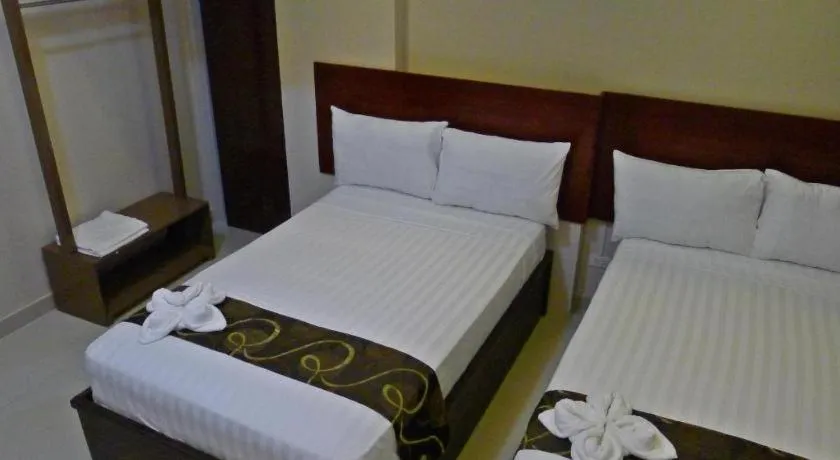 Bed in Rovic's Tourist Hotel
