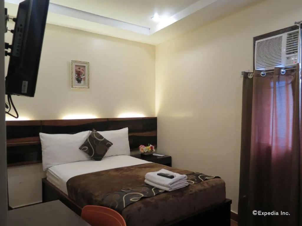 Bed in Rovic's Tourist Hotel