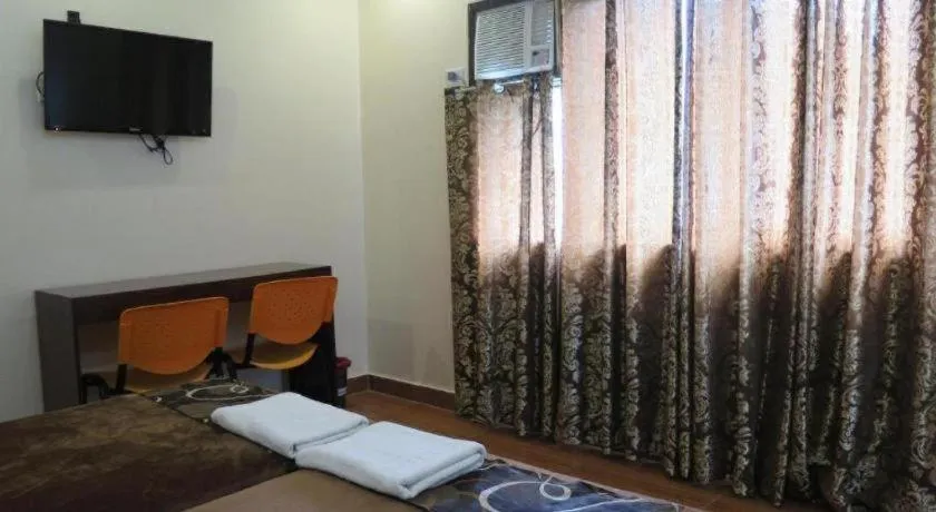 Bed in Rovic's Tourist Hotel