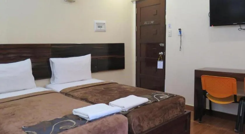 Bed in Rovic's Tourist Hotel