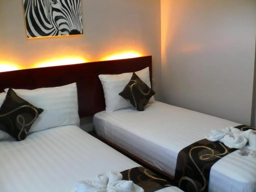 Bed in Rovic's Tourist Hotel