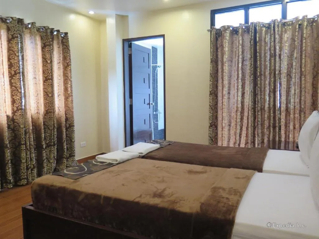 Bed in Rovic's Tourist Hotel