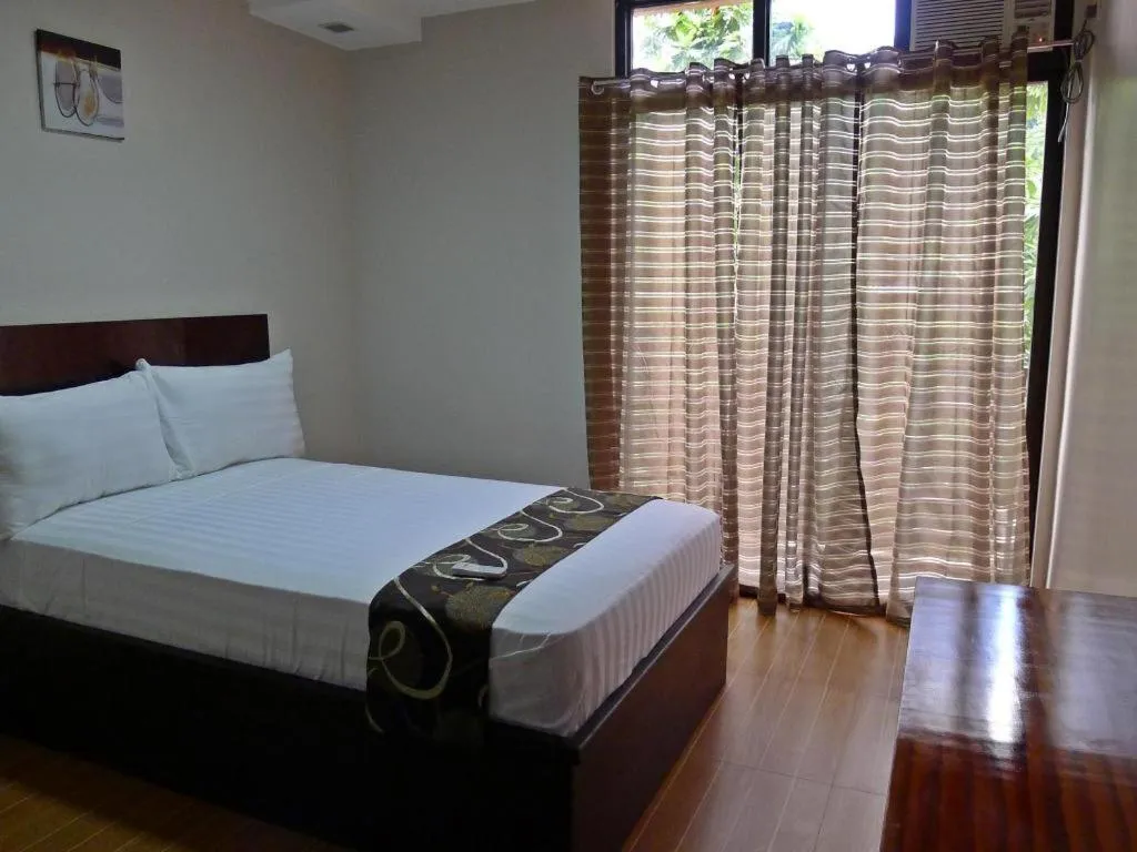 Bed in Rovic's Tourist Hotel