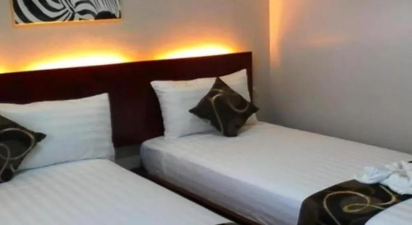 Bed in Rovic's Tourist Hotel