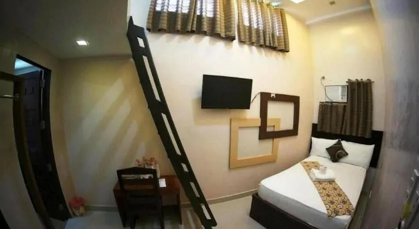 Bed in Rovic's Tourist Hotel