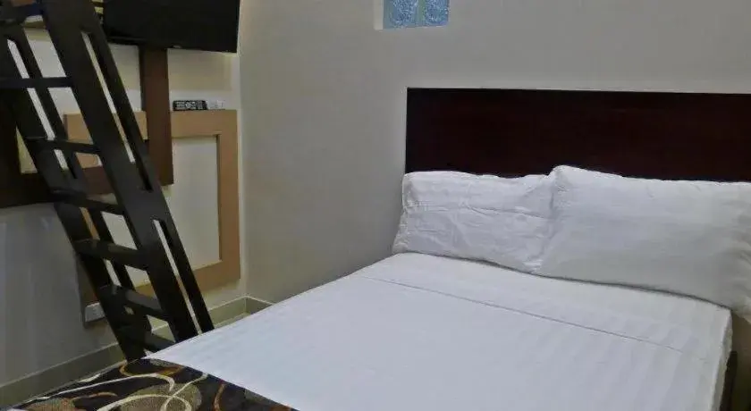 Bed in Rovic's Tourist Hotel Bed in Rovic's Tourist Hotel