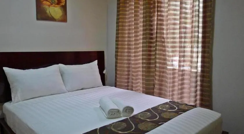 Bed in Rovic's Tourist Hotel