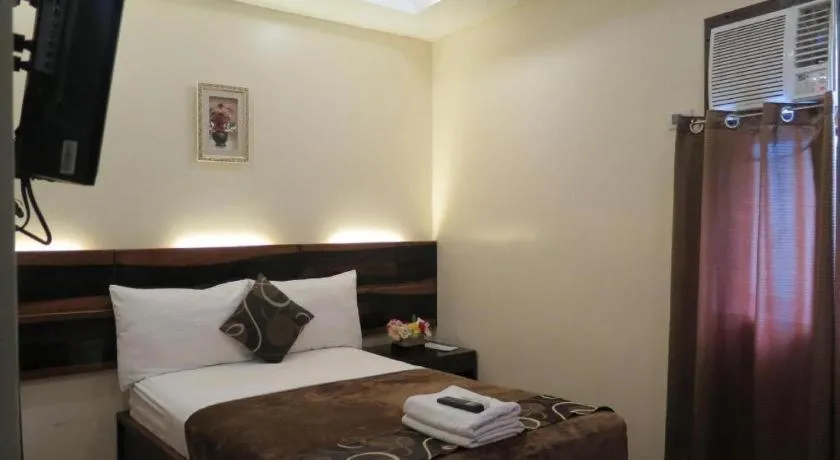 Bed in Rovic's Tourist Hotel