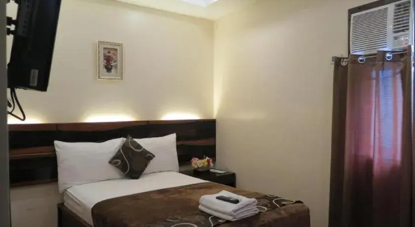 Bed in Rovic's Tourist Hotel Bed in Rovic's Tourist Hotel